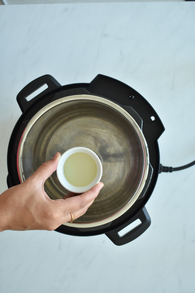 heat oil in instant pot - lobia masala step 1