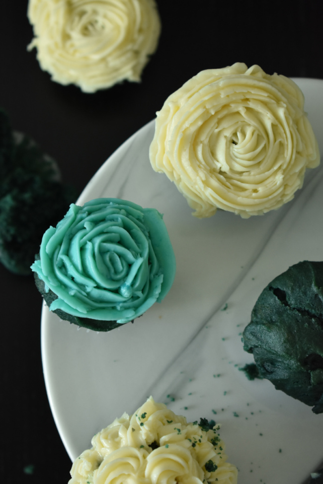 classic buttercream is used to decorate bluevelvet cupcakes. 